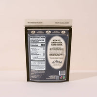 Snack package with a nutrition facts label on a light background