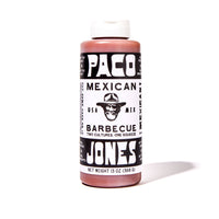 A bottle of Paco Mexican Barbecue Sauce by Paco Jones, featuring a black and white label with a cowboy hat logo, on a white background with a soft shadow.