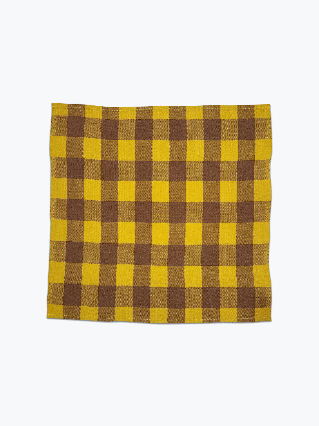 Large scale gingham plaid napkin of bright yellow and tan.