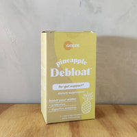A box of 8 packs of debloat powder drink mixes.