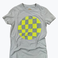 A light green short-sleeve crewneck t-shirt featuring a large circular graphic on the chest with a yellow and sage green checkerboard pattern.