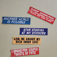 Set of humorous bumper stickers on a plain background