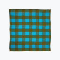 Chunky gingham plaid cloth napkin in bright sky blue and olive green.