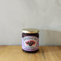 a jar of blackberry pepper jam made in texas.