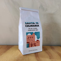A 15 oz bag of sante fe culinaria's blue corn pancake mix.