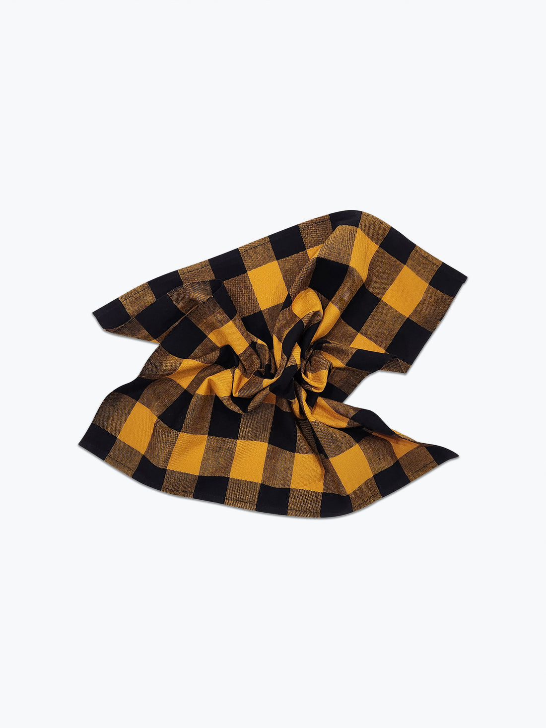 Large scale gingham plaid napkin in ochre yellow and black.