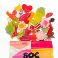 Assorted colorful candies with a 'Swedish Candy SOC' bag in the foreground on a white background