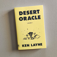 Book titled 'Desert Oracle' by Ken Layne on a gray background