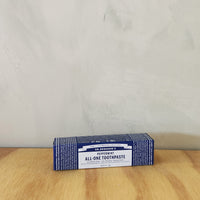 Dr Bronner's travel sized peppermint toothpaste.