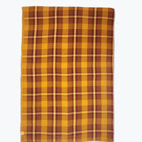 ochre and burgundy plaid tablecloth.