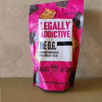 Pink snack bag labeled 'Legally Addictive' on a beige background
