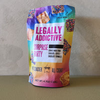 Colorful bag of 'Legally Addictive Surprise Party' cookies on a neutral background