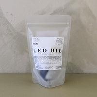 A stand-up pouch package labeled 'LEO OIL' with smaller text 'Earles serum' and on light neutral background.