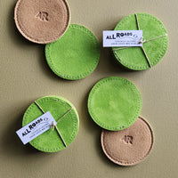 set of 4 suede coasters, one side lime green, the other side tan with an AR brand.