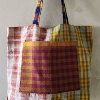 Plaid patterned tote bag on a plain background