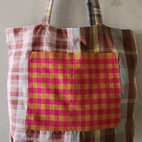 Plaid patterned tote bag on a plain background
