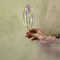 Iridescent rainbow spinner toy.