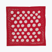 Red bandana with white circles