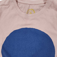 Pink t-shirt with a large blue circle and a small yellow logo on a white background