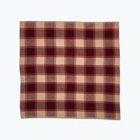 Plaid fabric with purple and beige pattern on a white background