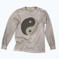 A tan long sleeved t-shirt with a large tonal brown ying yang screen print on the front.