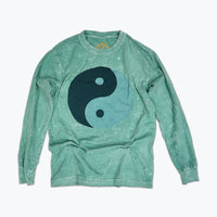A light teal long sleeved t-shirt with a large tonal green ying yang screen print on the front.