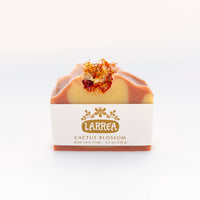 Larrea cactus blossom soap bar with visible brand logo on a white background
