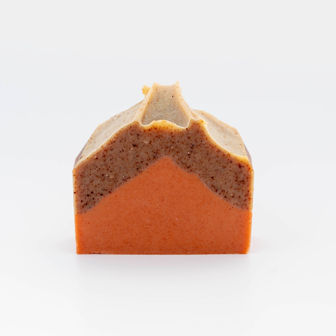 Two-tone soap bar with a brown and orange gradient on a white background