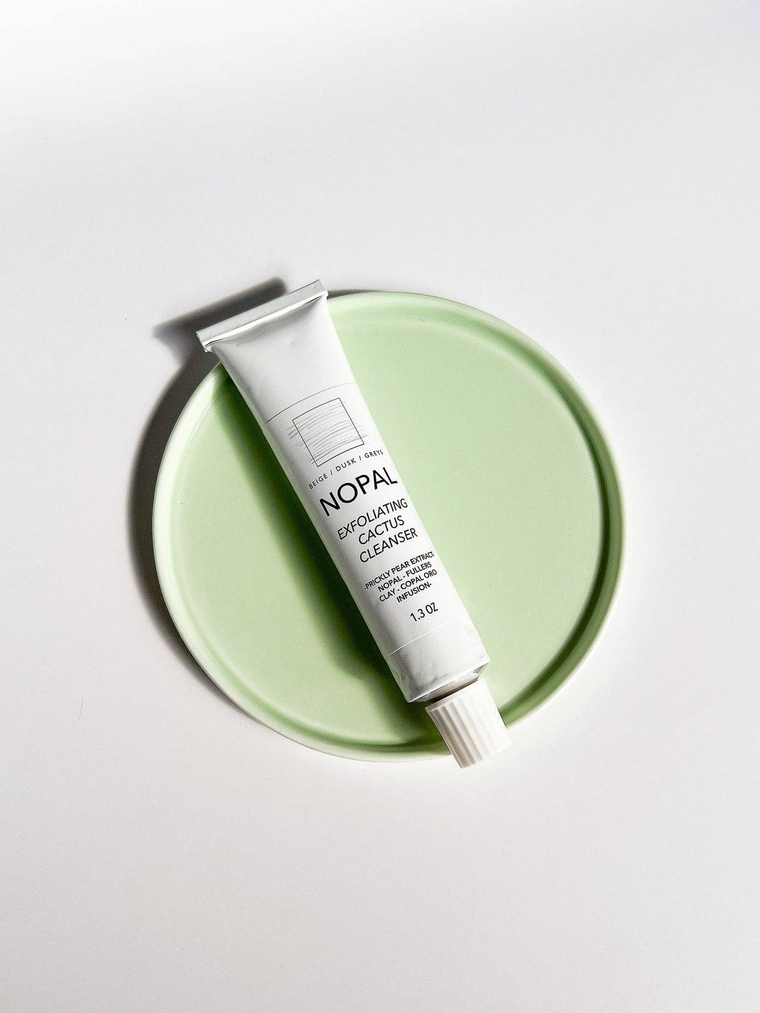 Skincare tube labeled &