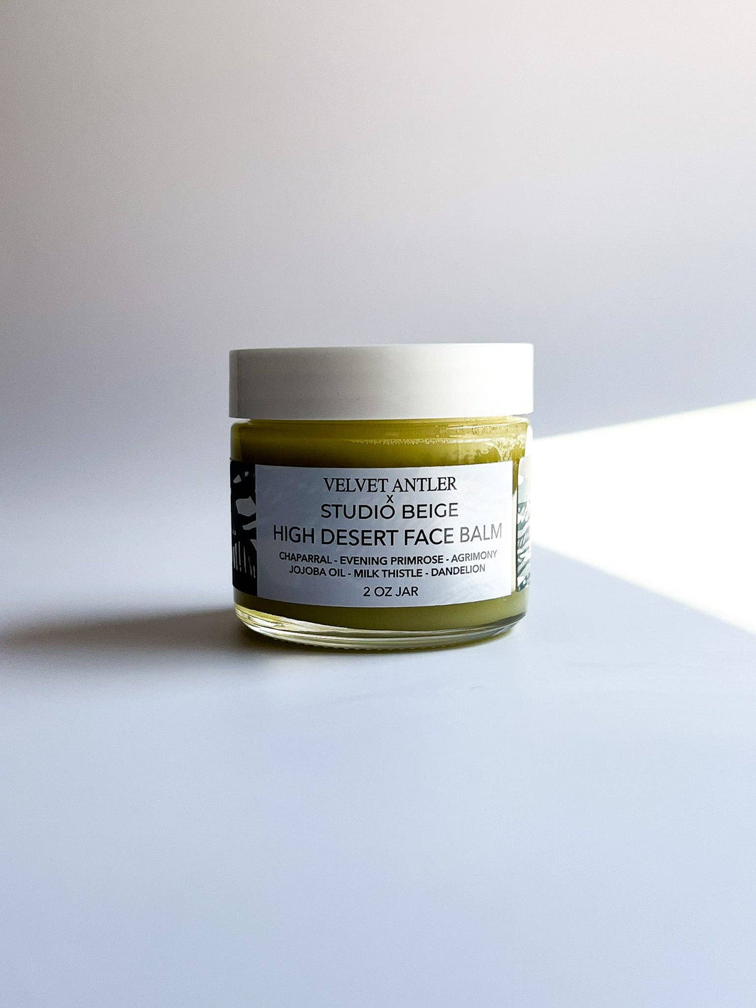 Jar of high desert face balm on a light gray background