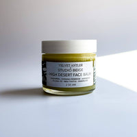 Jar of high desert face balm on a light gray background