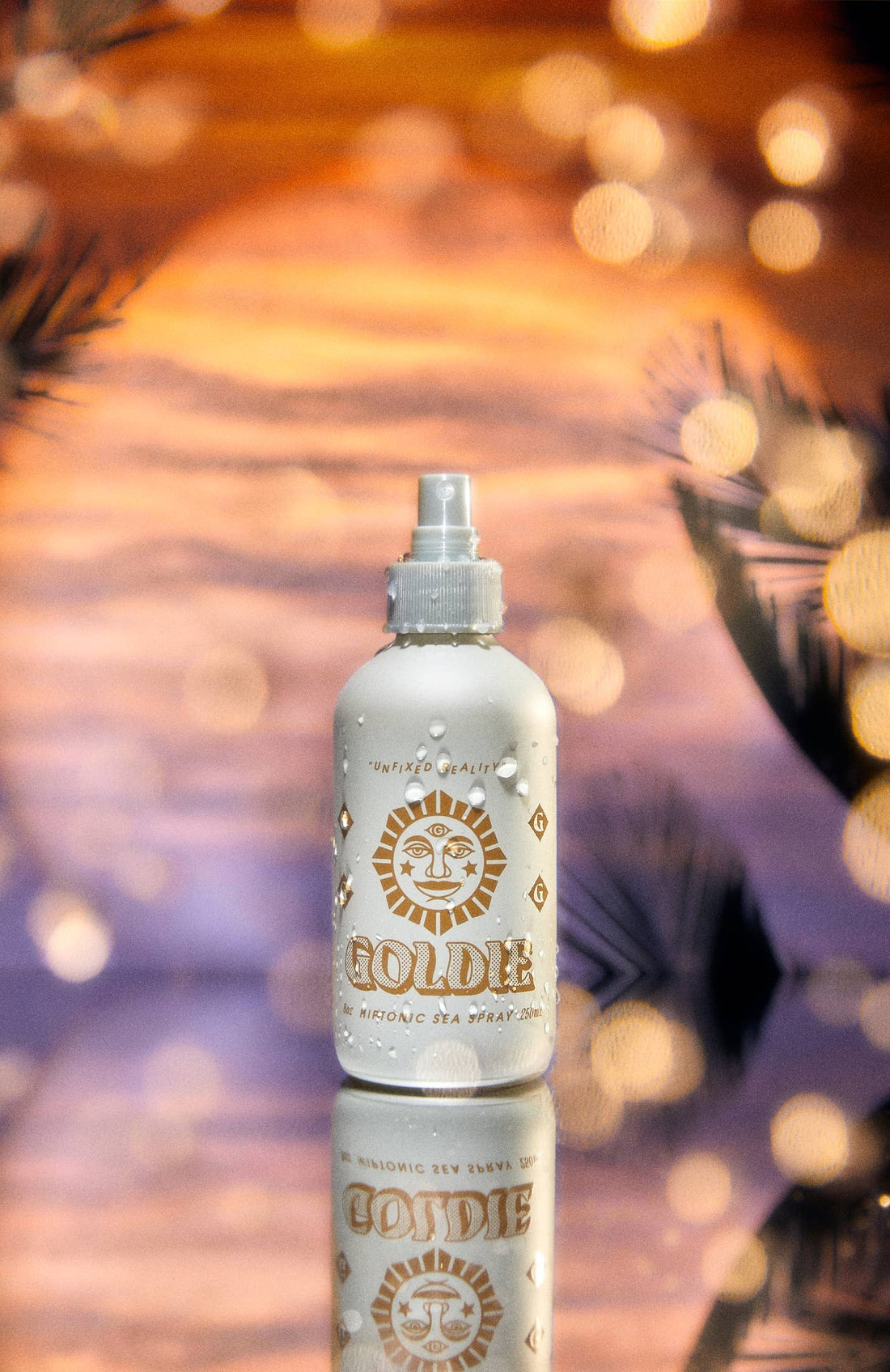 Bottle of Goldie hair spray with a blurred background