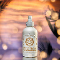 Bottle of Goldie hair spray with a blurred background