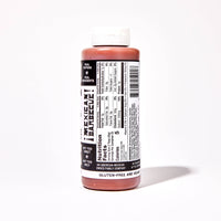 A bottle of Mexican Hot Sauce showing the back label with nutritional information and a white cap, set against a plain white background.