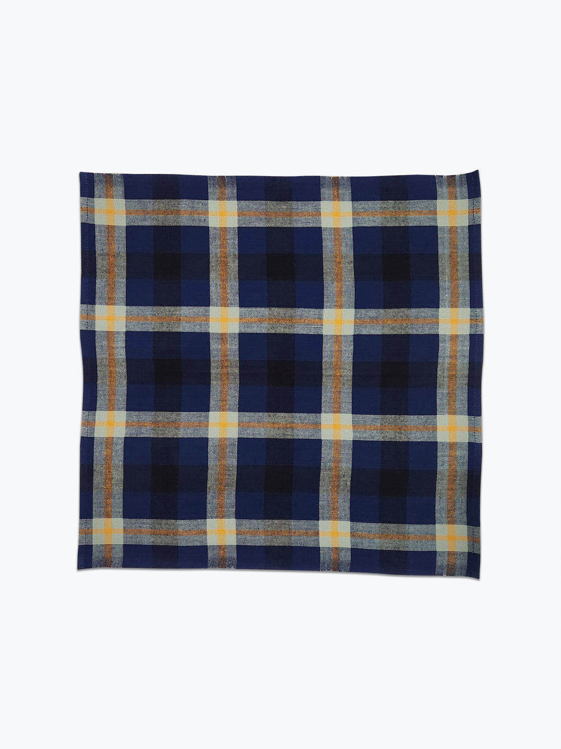 Plaid napkin in deep blue, navy and sage green.