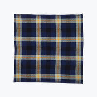 Plaid napkin in deep blue, navy and sage green.