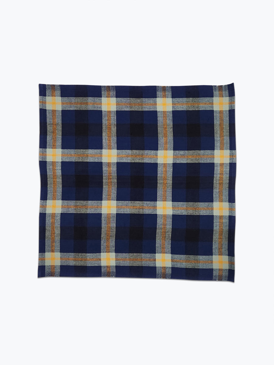 Plaid napkin in deep blue, navy and sage green.