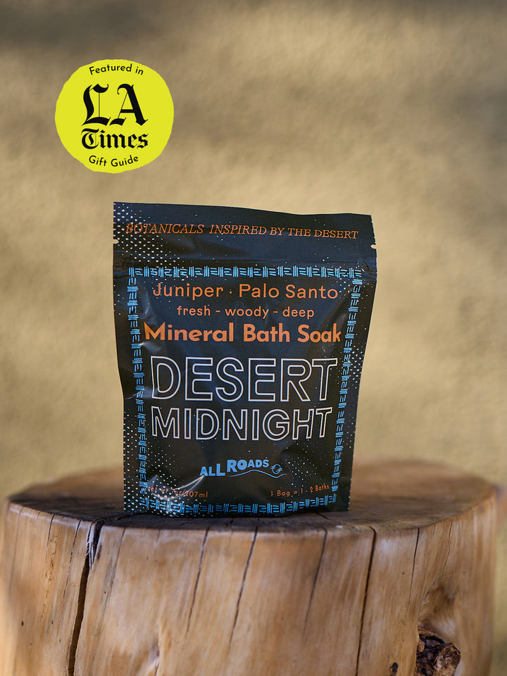 Mineral bath sock packaging labeled 'Desert Midnight' on a wooden surface with 'LA Times' gift guide badge.