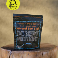 Mineral bath sock packaging labeled 'Desert Midnight' on a wooden surface with 'LA Times' gift guide badge.