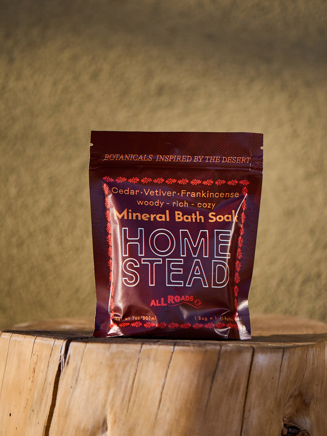Home Stead Mineral Bath Soap package on a wooden surface with a blurred natural background