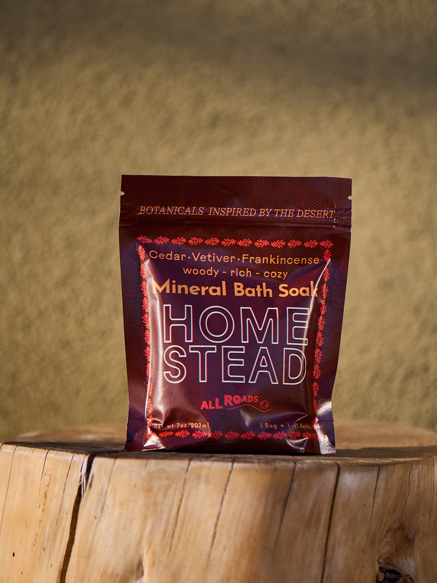 Home Stead Mineral Bath Soap package on a wooden surface with a blurred natural background