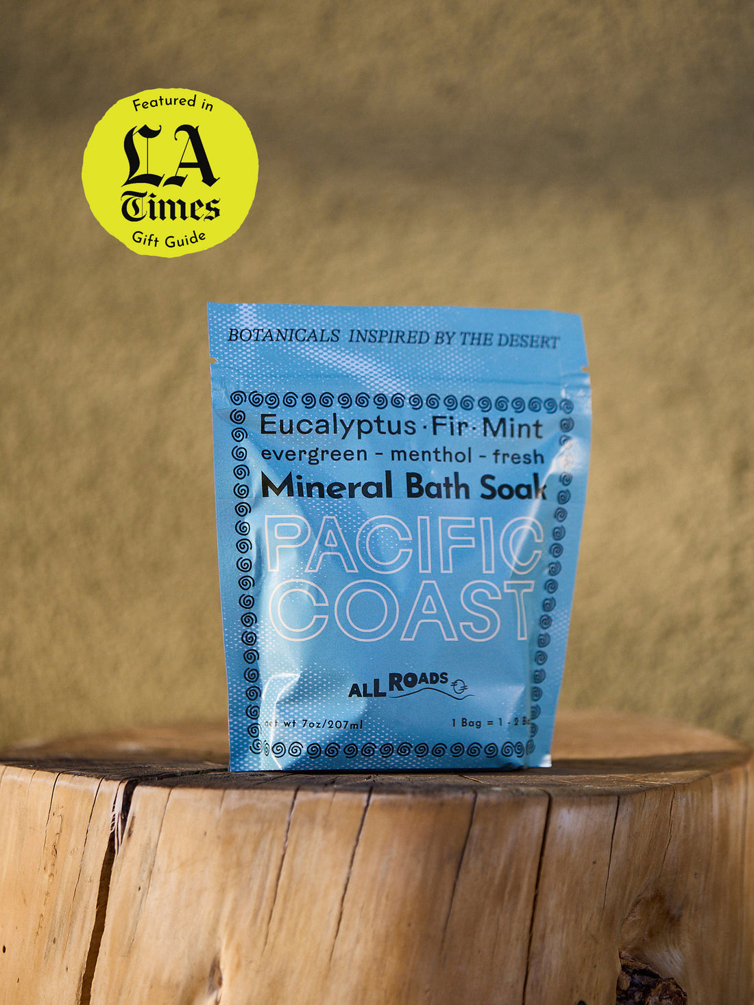 Blue package of Pacific Coast Mineral Bath Soap on a wooden surface with &