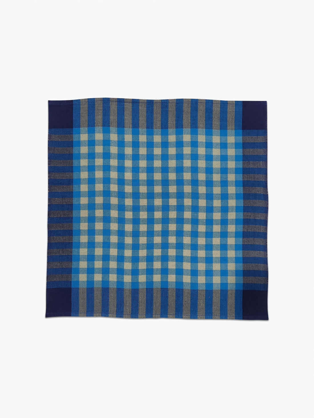 Blue and beige checkered fabric napkin on a white background
