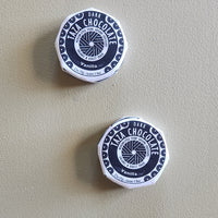 Two containers of Taza Chocolate Vanilla on a beige background