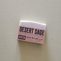 Desert Sage soap bar with a label on a light gray background