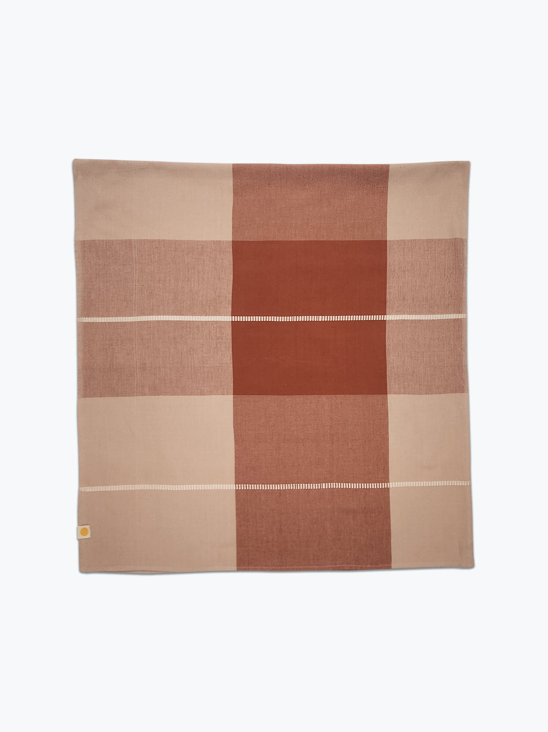 Checkered tablecloth with brown and beige squares on a white background