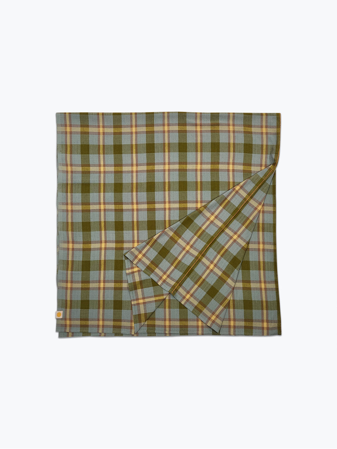 Plaid tablecloth in shades of greens and butter yellow.
