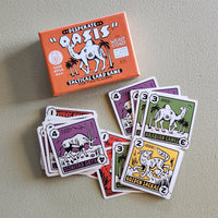 Desert Oasis tactical card game with cards and packaging on a gray surface