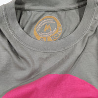 Green and pink shirt with a brand logo on the collar