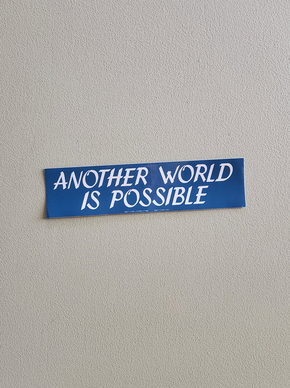 Blue sticker with &